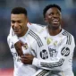 Penyerang Real Madrid Kylian Mbappe (kiri) merayakan keberhasilannya mencetak gol bersama Vinicius Junior (kanan) pada pertandingan Liga Spanyol menghadapi Alaves di Stadion Mendizorroza, Vitoria-Gasteiz, Minggu (14/12/2025) waktu setempat. (realmadrid.com)