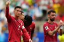 Cristiano Ronaldo merivalkan tangan ke penonton usai kemenangan besar Portugal atas Uzbekistan dalam pertandingan grup Piala Dunia 2026. (Anadolu/Hakan Zakun)
