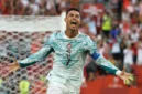 Ronaldo berselebrasi setelah mencetak gol penyeimbang lewat titik penalti pada menit ke-68. (FIFA.com)