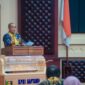 Yanyan Ruchyansyah, membacakan sambutan tertulis Gubernur Lampung saat membuka secara resmi Rapat Anggota Tahunan (RAT) Koperasi Pegawai Republik Indonesia (KPRI) Saptawa Provinsi Lampung Tahun Buku 2025 di Gedung Pusiban