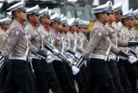 Ilustrasi - Pasukan polisi (CNBC)