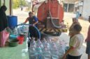 AIR BERSIH-Warga ramai-ramai mengambil air bersih yang didistribusikan oleh BPPD Demak. (Foto Ist).